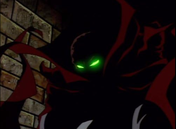 The comic book character spawn stands in silhouette against a stone wall and his eyes glow green