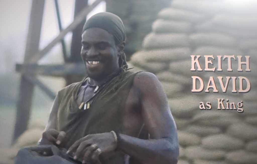 A US soldier in Vietnam stands in base camp and holds a fuel can