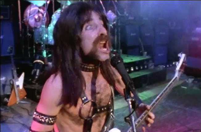 Derek Smalls plays bass and makes a fierce face